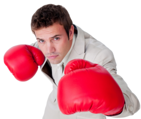 Confident businessman wearing boxing gloves