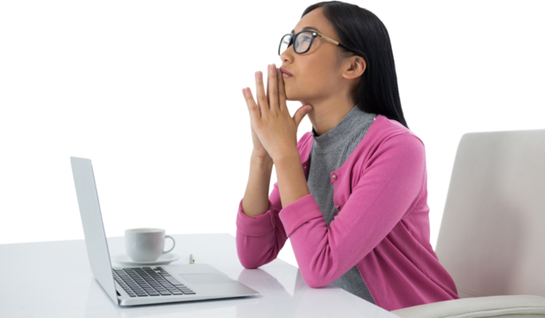 Thoughtful female executive with laptop looking up - Powered by Adobe
