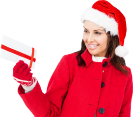 Beautiful woman in Santa costume holding Christmas gift