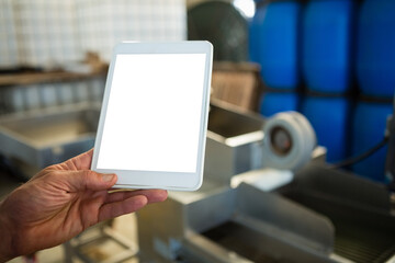 Hand of worker holding digital tablet