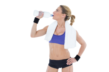 Strong blonde drinking from water bottle