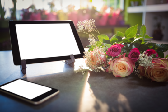 Mobile phone and tablet on table - Powered by Adobe