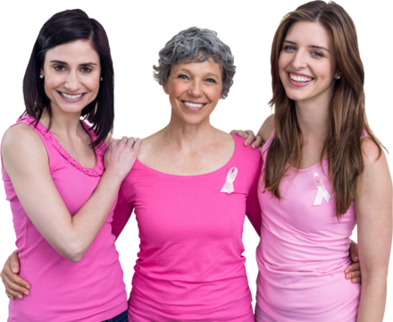 Portrait of smiling women in pink outfits posing for breast cancer awareness