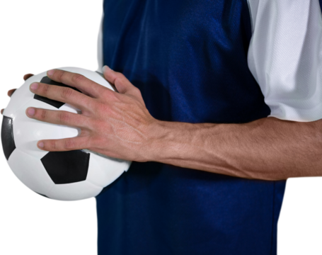 Mid section of athlete holding ball