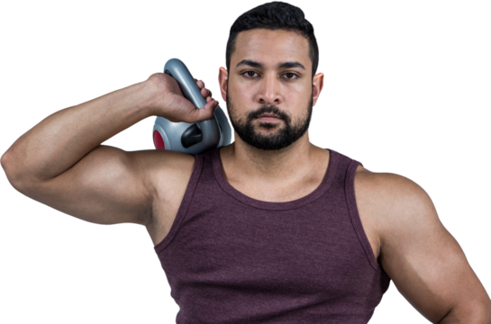Muscular serious man holding a kettlebell