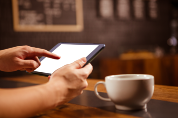 Close up of hands using a tablet computer