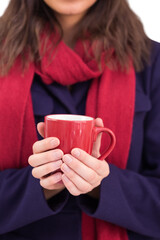 Woman in warm clothing holding mug