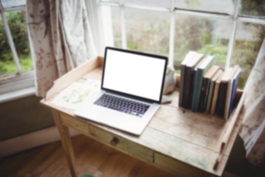 Laptop computer on wooden table