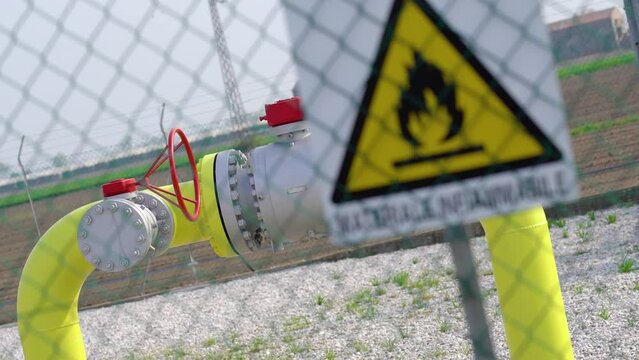 Big gas pipelines behind the flammable material sign