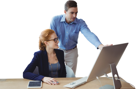 Colleagues discussing over computer at table
