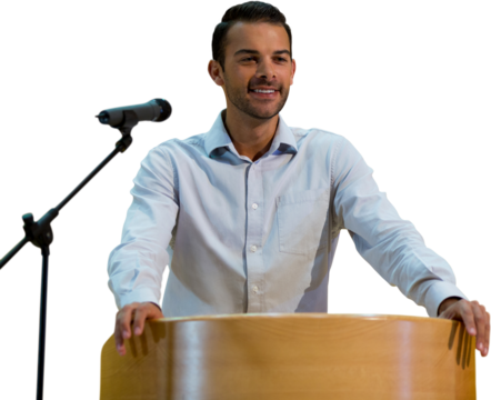 Smiling businessman giving speech at podium