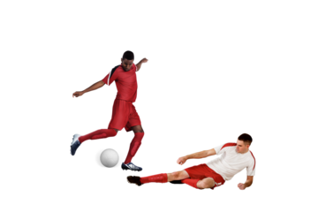 Football players tackling for the ball