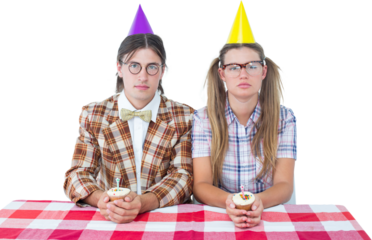 Unsmiling geeky hipsters celebrating birthday 