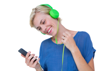 Happy woman enjoying music with her mobile phone