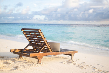 Naklejka na ściany i meble beach chairs on beautiful tropical beach