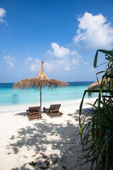 beach chairs on beautiful tropical beach