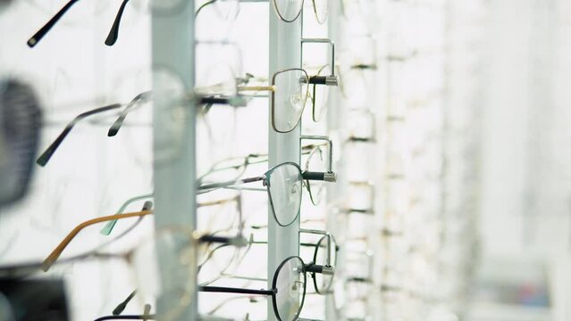 Showcase with glasses in modern optic store