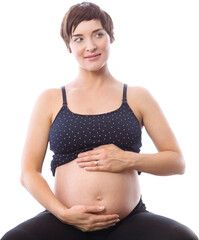 Thoughtful pregnant woman holding belly