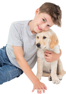 Boy holding puppy 