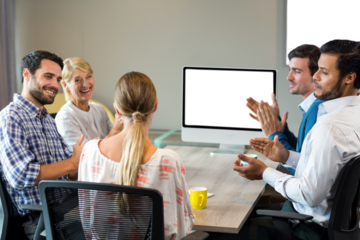 Colleagues applauding at presentation of businesswoman
