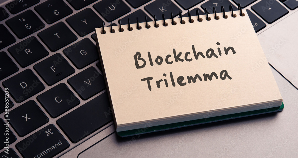 Poster there is note book with the word blockchain trilemma on a laptop. it is an eye-catching image.