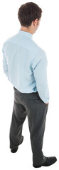 Businessman standing with hands in pockets