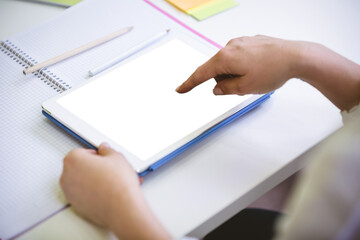 Cropped image of businesswoman touching digital tablet at office