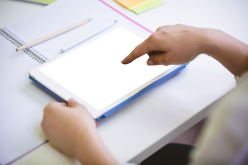 Cropped image of businesswoman touching digital tablet at office