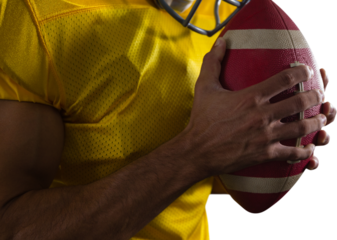 Mid section of player with American football
