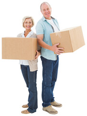 Older couple smiling at camera holding moving boxes