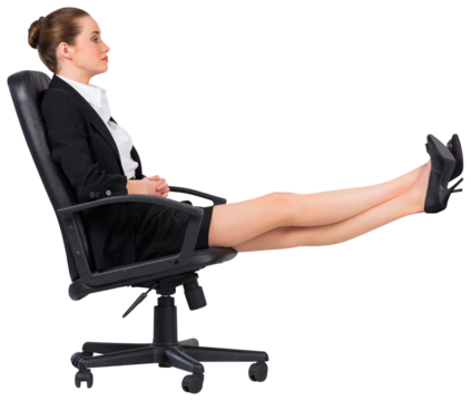 Businesswoman sitting on swivel chair with feet up