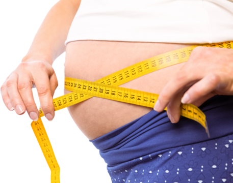 Pregnant woman measuring her bump