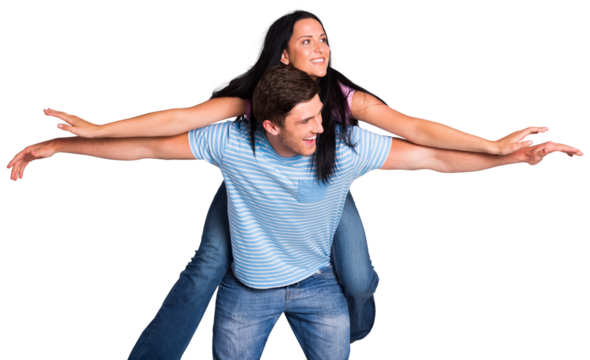 Young man giving girlfriend a piggyback ride