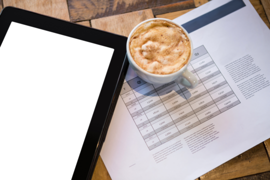 Digital tablet with coffee and document on table
