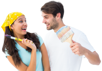 Happy young couple painting together and laughing