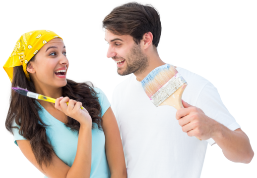 Happy young couple painting together and laughing