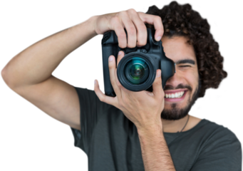 Smiling male photographer taking picture