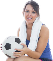 Portrait of happy woman in sportswear holding football