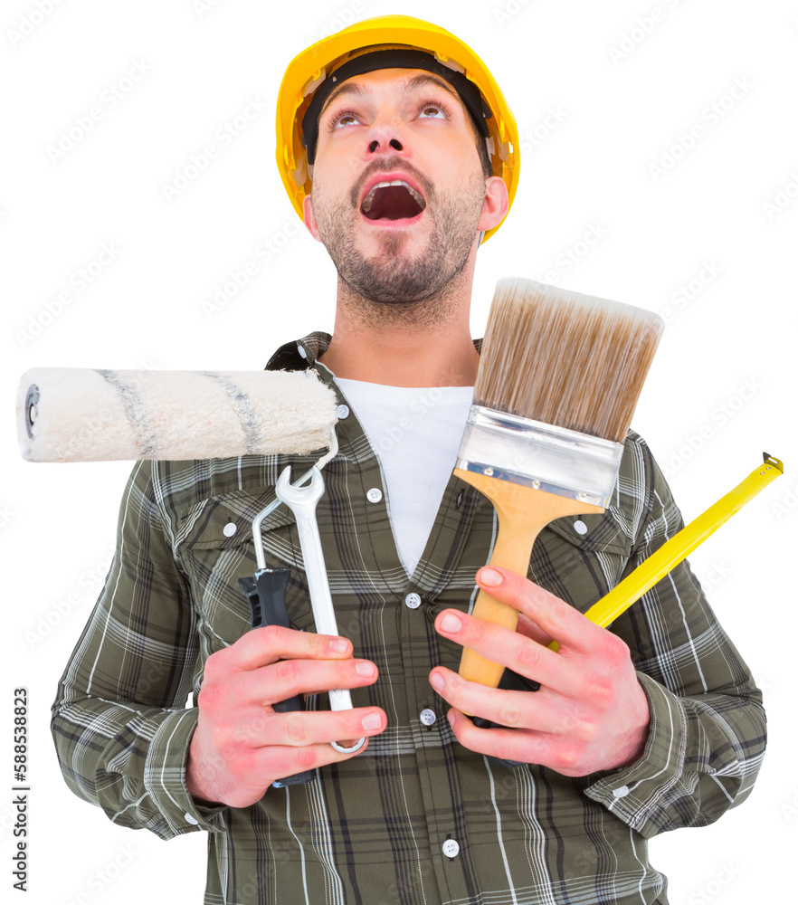 Wall mural Screaming manual worker holding various tools