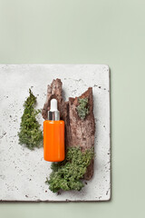 Beauty serum on pale green background withwood and moss, top view. Minimalistic scandi style, copy space - 588539014
