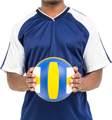 Mid-section of sportsman holding a volleyball