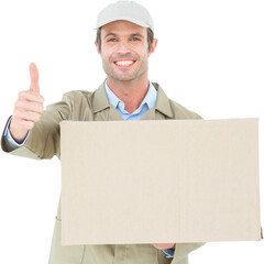 Happy delivery man gesturing thumbs up while carrying cardboard box