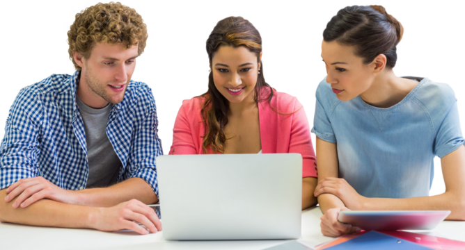 Coworkers discussing over laptop while sitting at desk