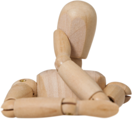 Wooden 3d figurine leaning on table