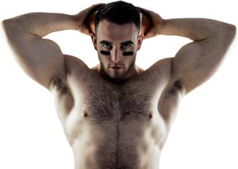 Shirtless American football player with ball