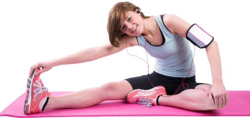 Pretty brunette doing the hamstring stretch on exercise mat