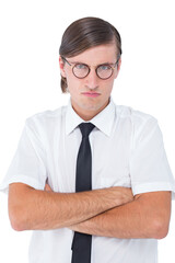 Geeky businessman looking at camera with arms crossed