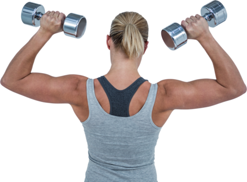 Muscular woman working out with dumbbells
