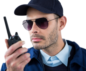 Close up of security officer talking on walkie talkie 