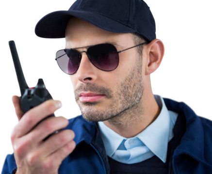 Close up of security officer talking on walkie talkie 